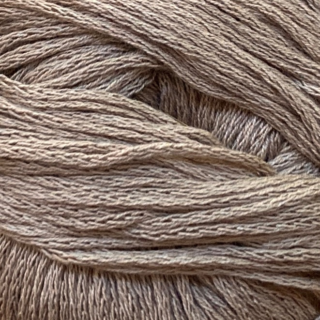 Close up on a medium brown ball of M&K Eco Bomull yarn.