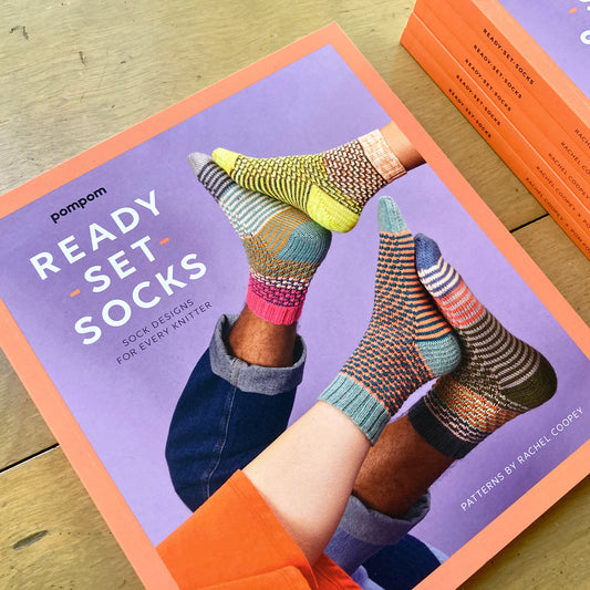 Stack of Ready Set Socks books, with colorful socks on the cover.