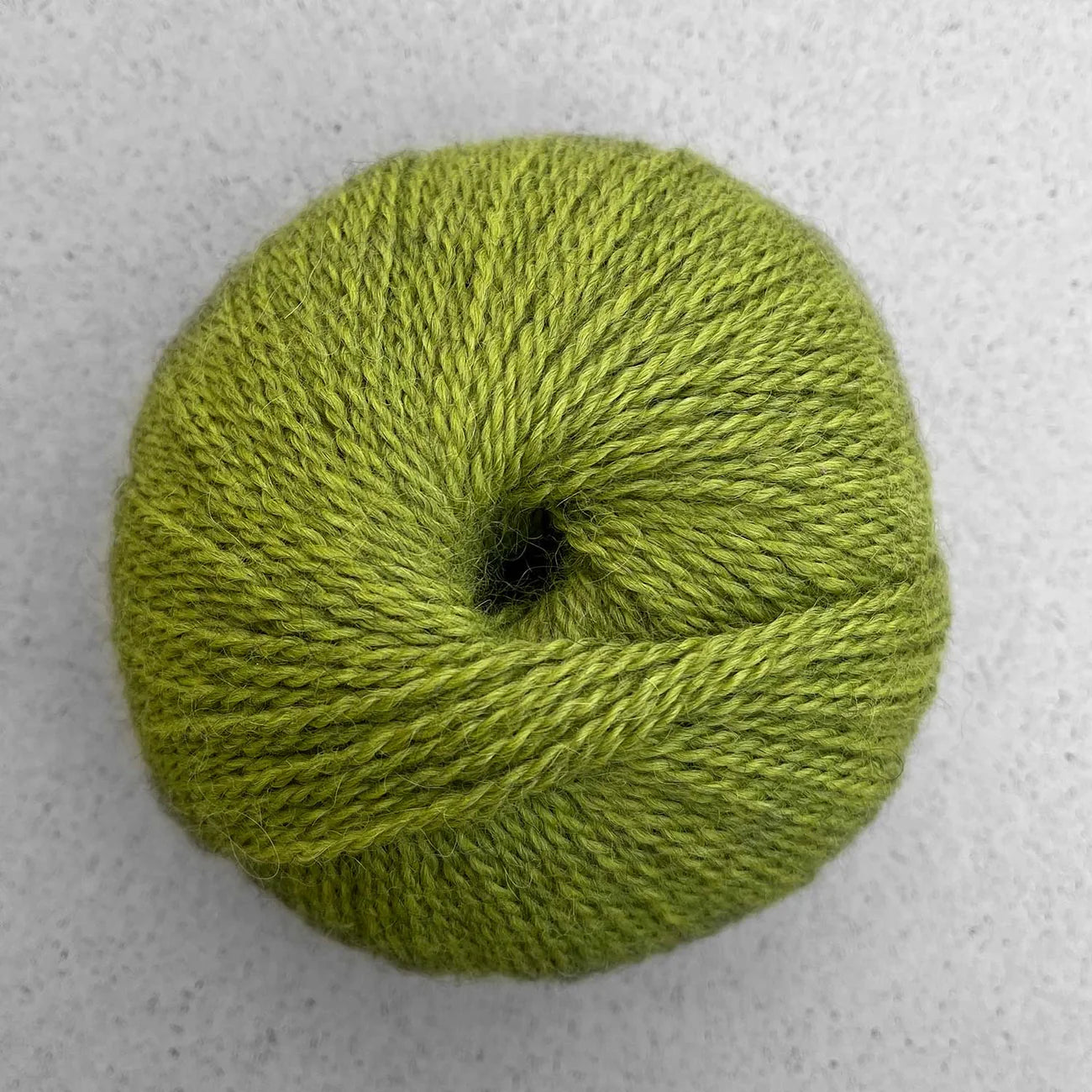 Ball of bright green Pascuali Balayage yarn.