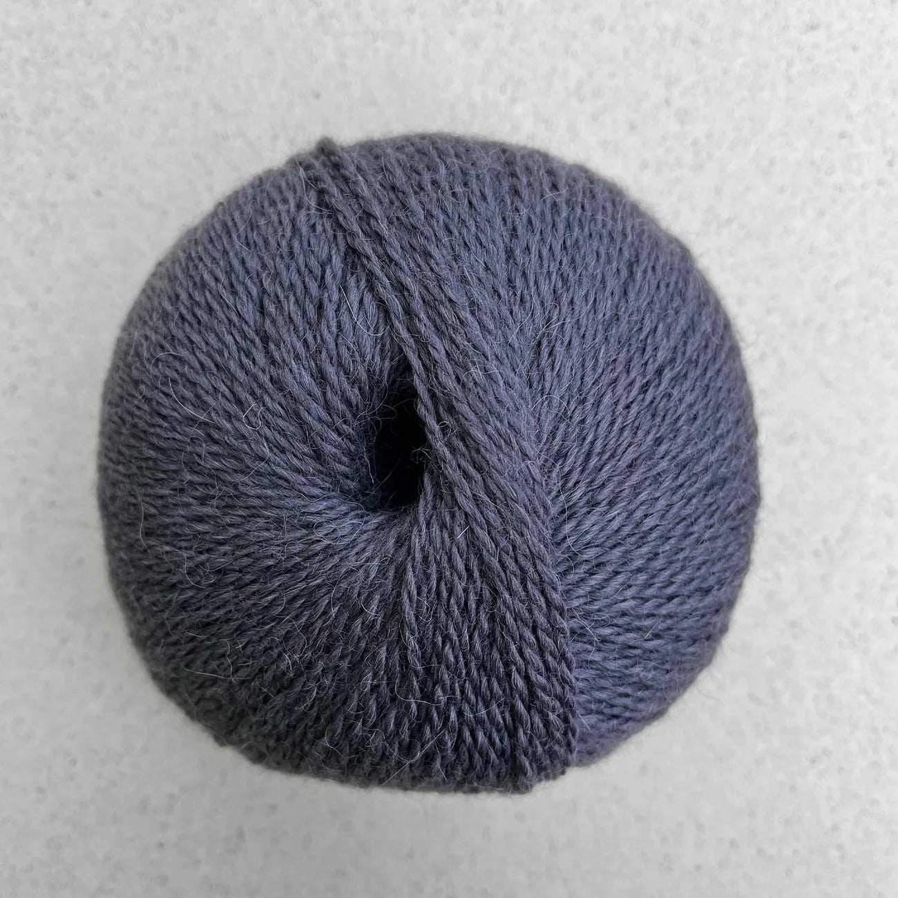 Ball of slate gray Pascuali Balayage yarn.