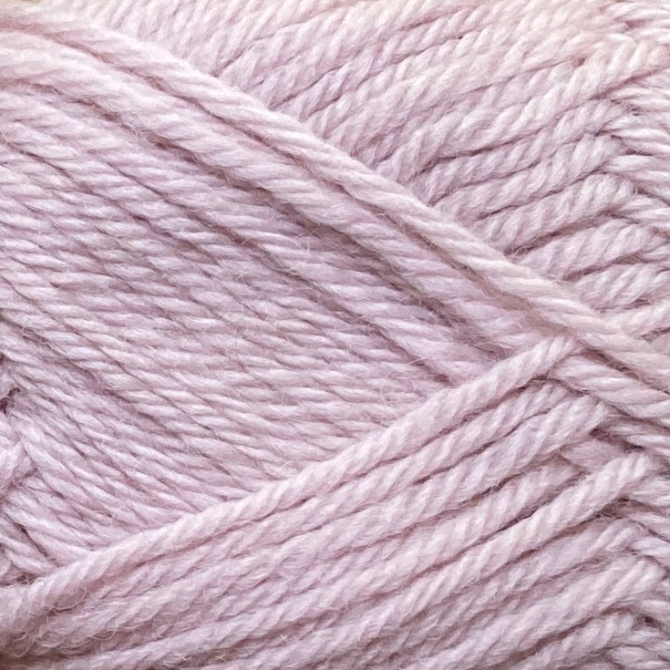 Close up on a light pink ball of Jo Sharp Classic Wool DK yarn.