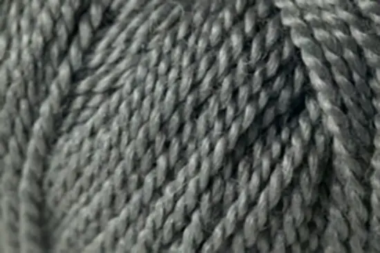 Close up on a ball of gray Jo Sharp Alpaca Kid Lustre yarn.