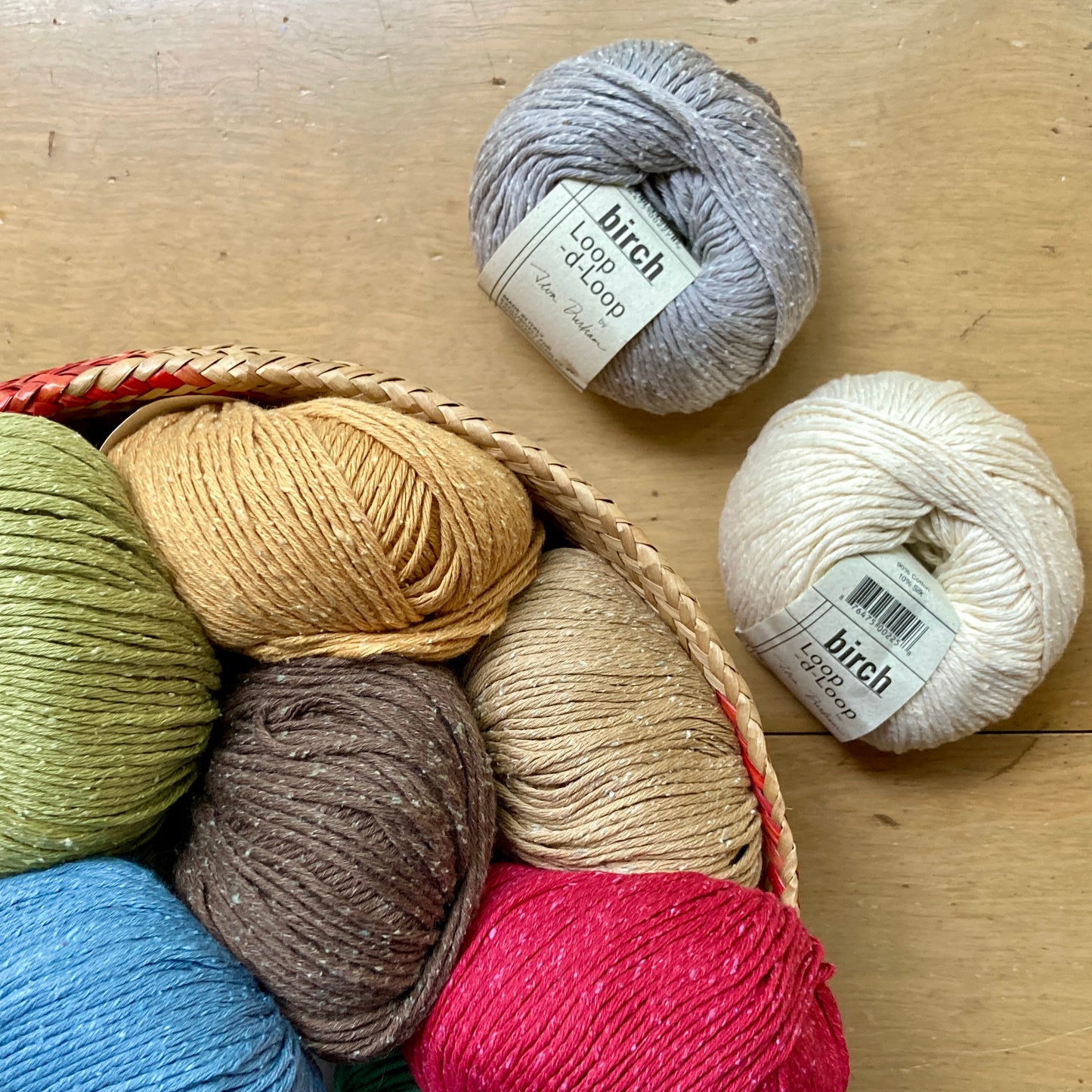Colorful balls of Birch yarn, from Loop-d-Loop by Teva Durham.