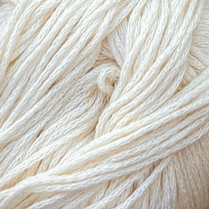 Close up on an ivory ball of M&K Eco Bomull yarn.