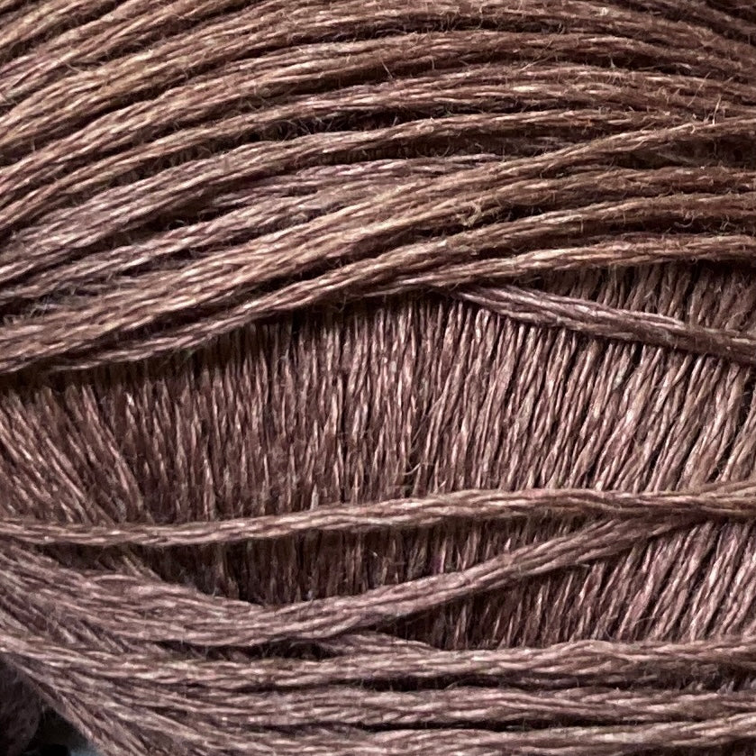 Close up on a brown ball of Katia Lino 100% yarn.
