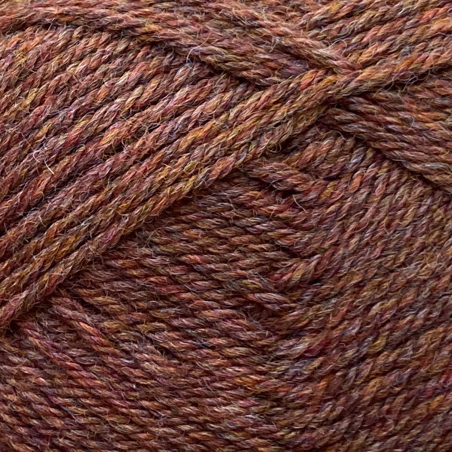 Close up on a brown ball of Jo Sharp Classic Wool DK yarn.