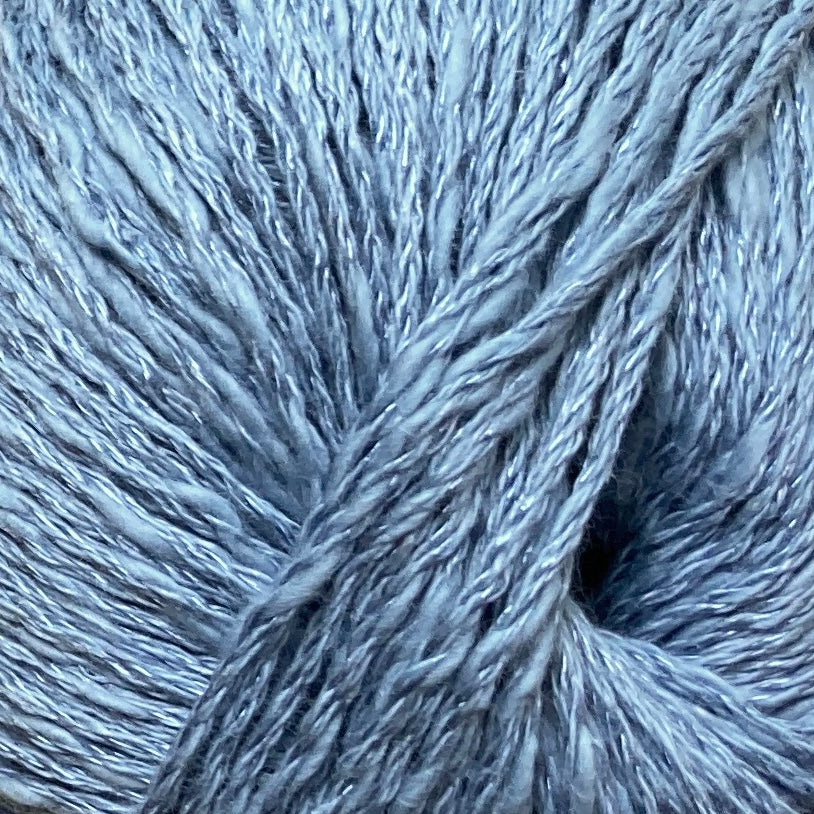 Close up on a light blue ball of Katia Liana yarn.