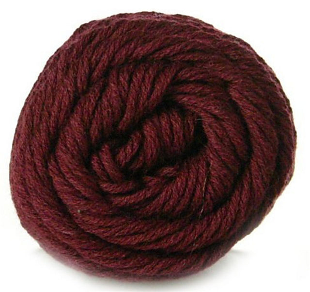 Close up on a burgundy skein of Brown Sheep Cotton Fleece yarn.