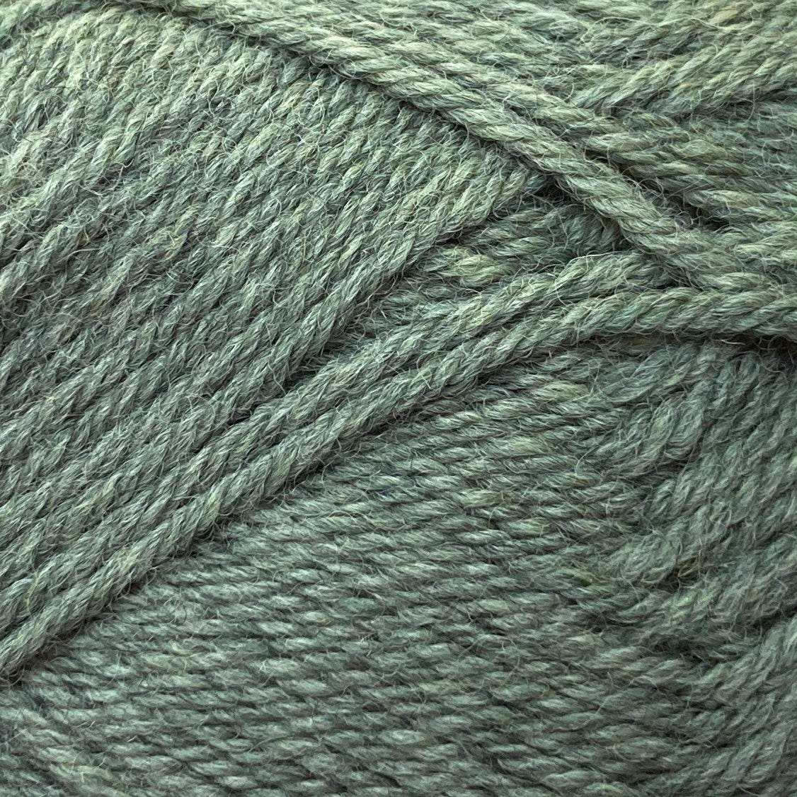 Close up on a green ball of Jo Sharp Classic Wool DK yarn.