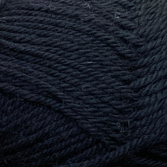 Close up on a black ball of Jo Sharp Classic Wool DK yarn.