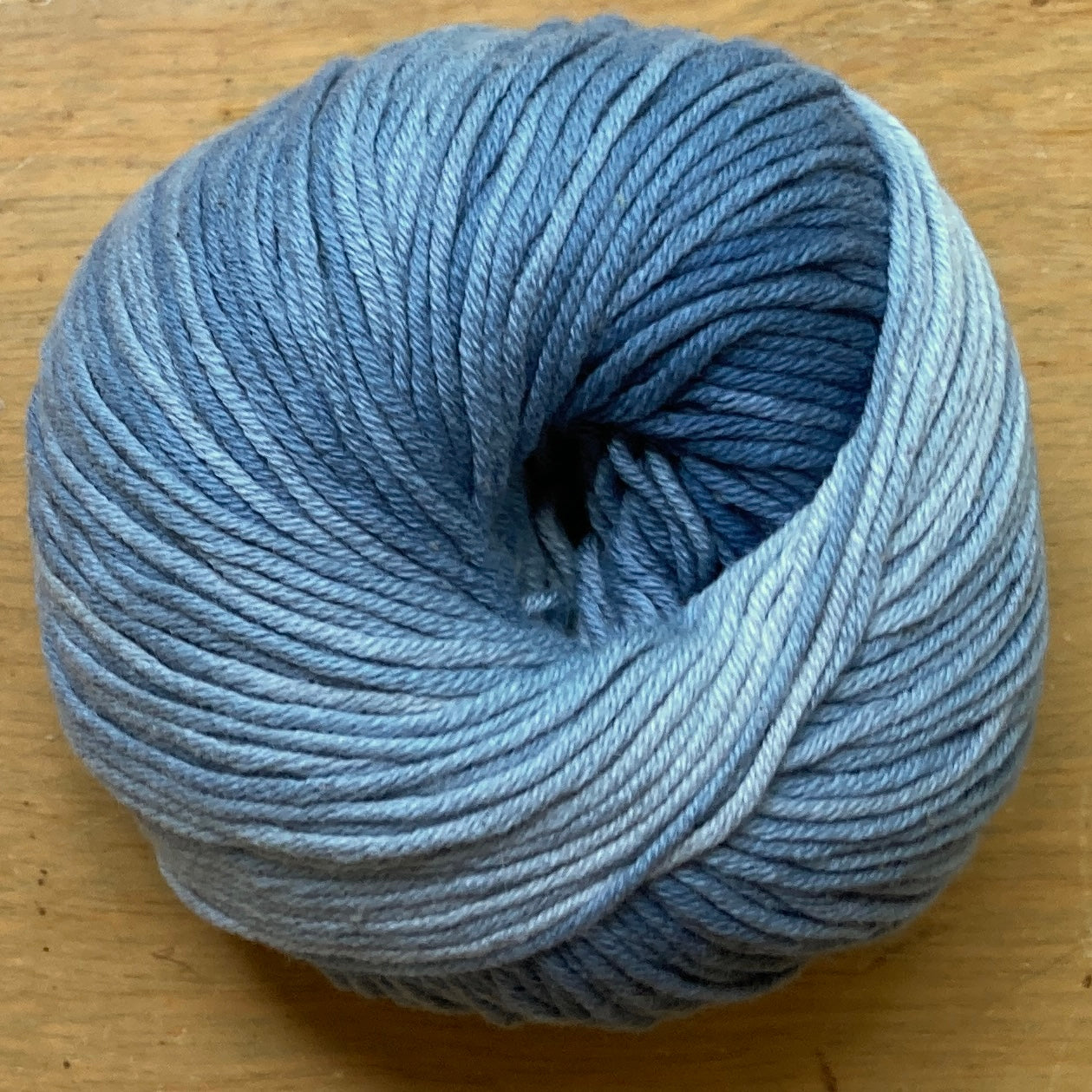 Ball of Katia Degrade yarn in shades of light blue.