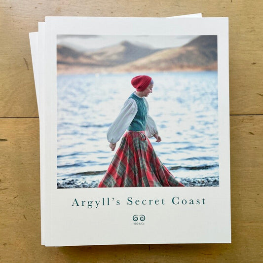 Image of Kate Davies book cover on wooden surface.