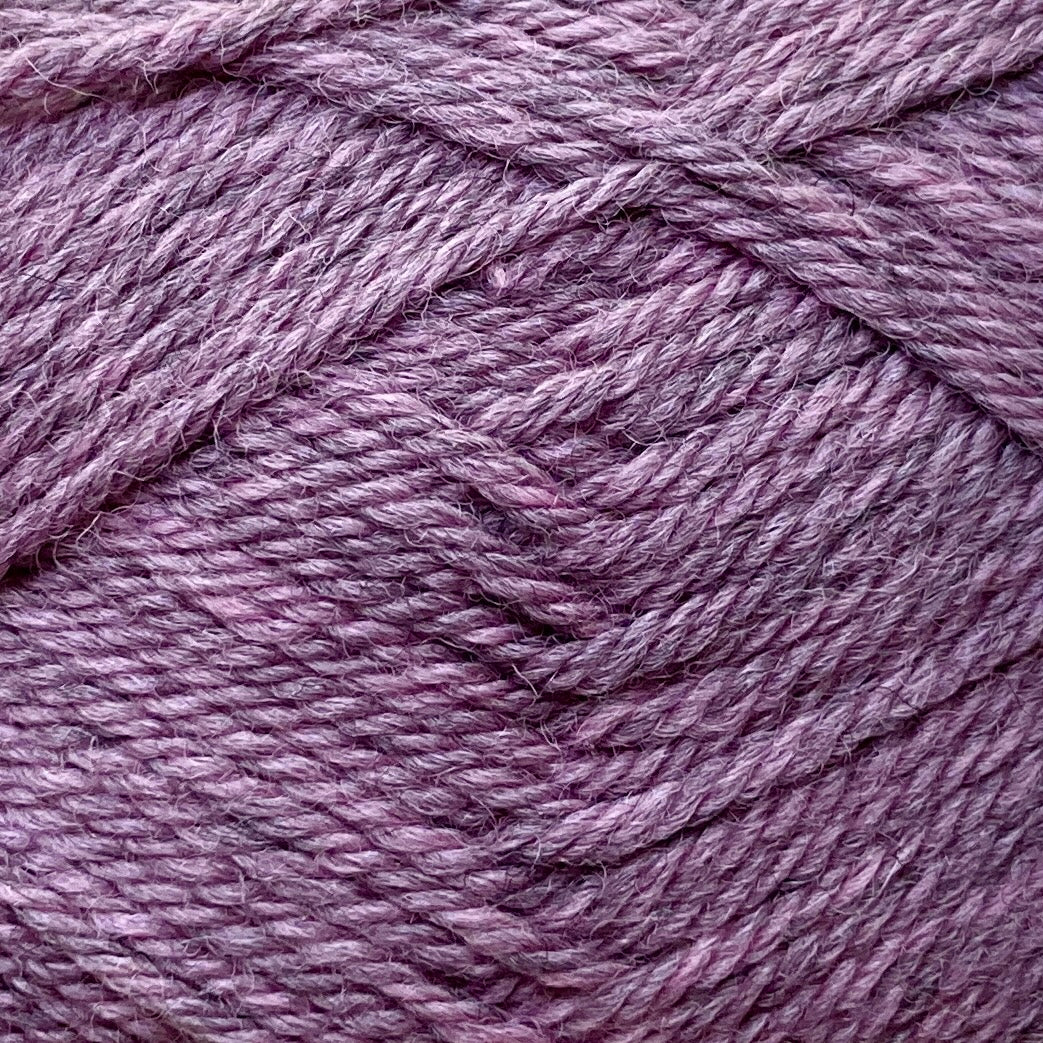 Close up on an orchid purple ball of Jo Sharp Classic Wool DK yarn.