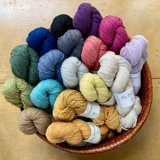 Colorful skeins of BC Garn Bio Balance yarn in a basket at Hillsborough Yarn Shop