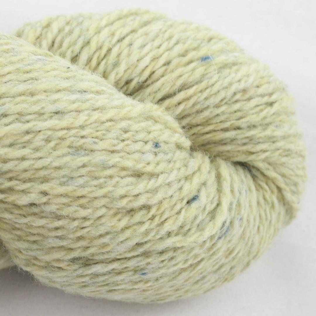 Close up on a pale yellow green skein of BC Garn Loch Lomond yarn color 14.