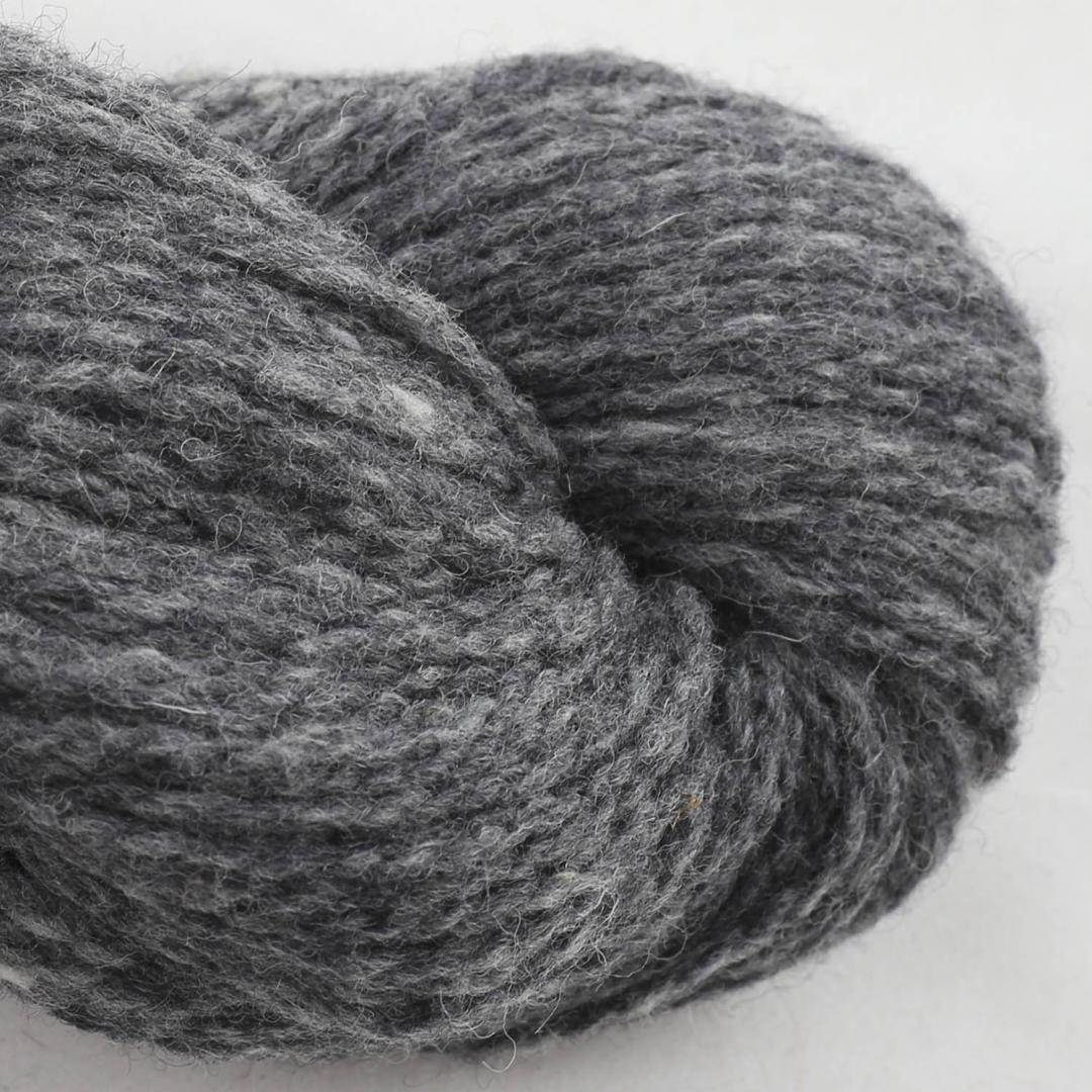 Close up on a charcoal gray skein of BC Garn Loch Lomond yarn color 15.