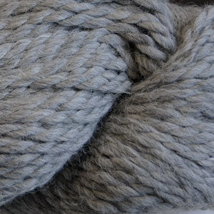 Close up on a skein of light gray Cascade Baby Alpaca Chunky yarn.