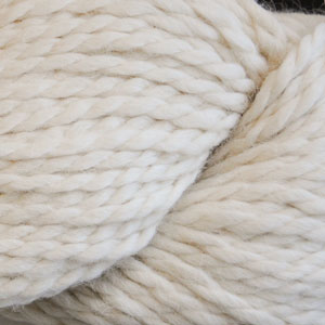 Close up on a skein of natural white Cascade Baby Alpaca Chunky yarn.