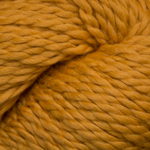 Close up on a skein of sunflower yellow Cascade Baby Alpaca Chunky yarn.