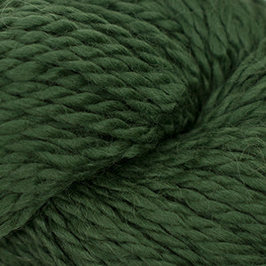 Close up on a skein of dark green Cascade Baby Alpaca Chunky yarn.