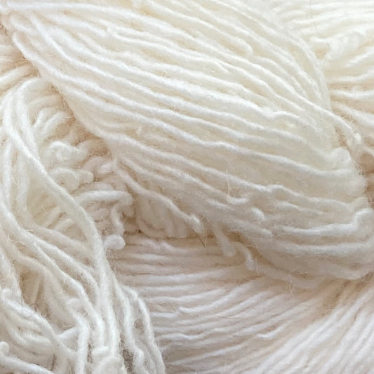 Close up on a bright white skein of Briggs & Little Sport yarn.