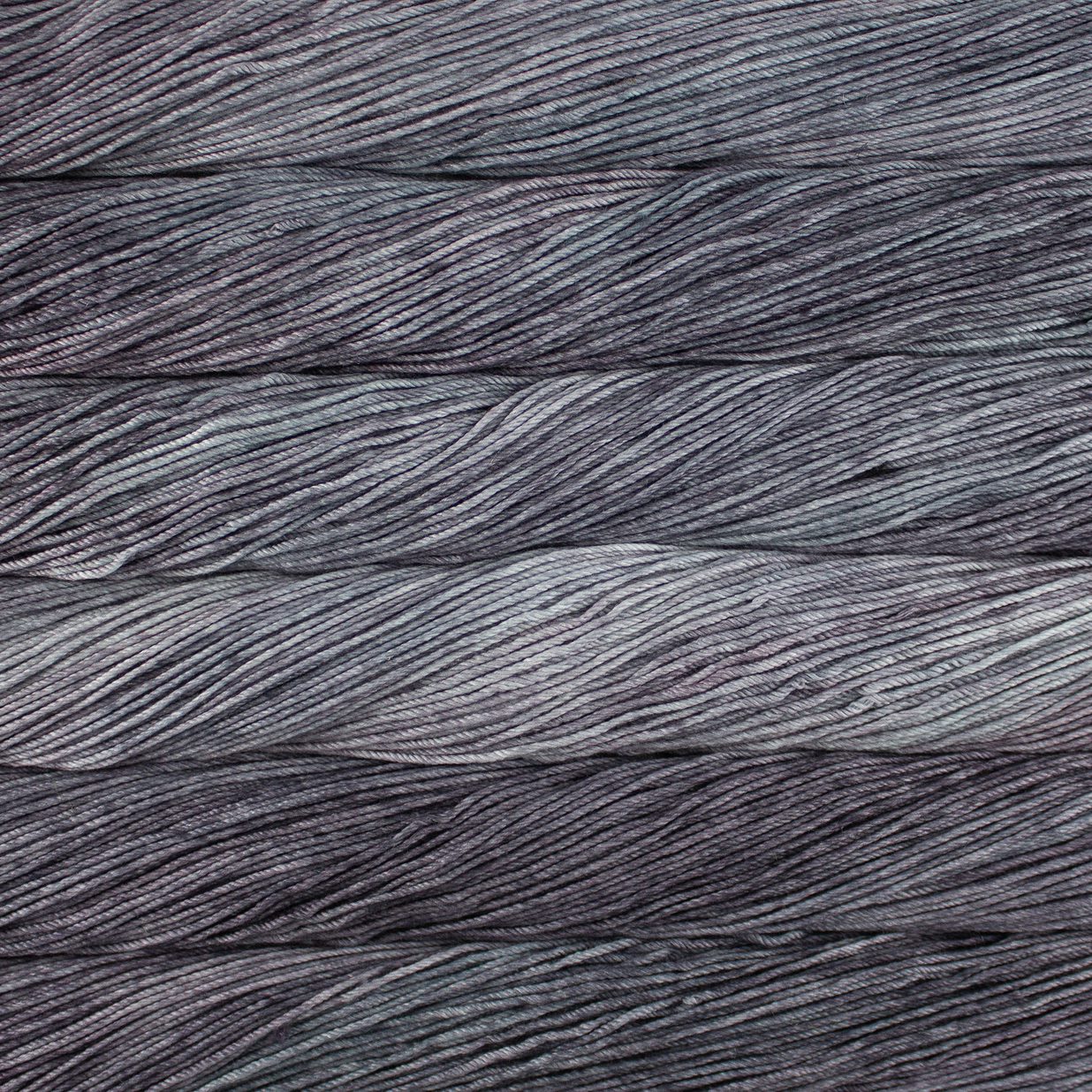 Skein of semisolid gray Malabrigo Caprino yarn.