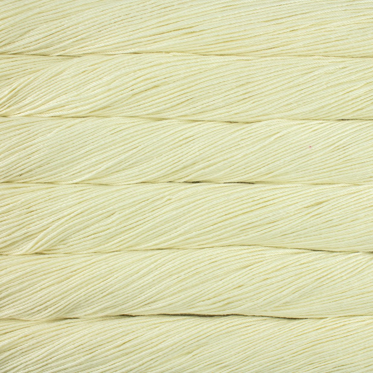 Skein of natural white Malabrigo Caprino yarn.