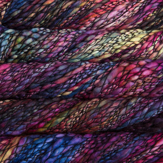 Skein of variegated pink, purple, and yellow Malabrigo Caracol yarn.