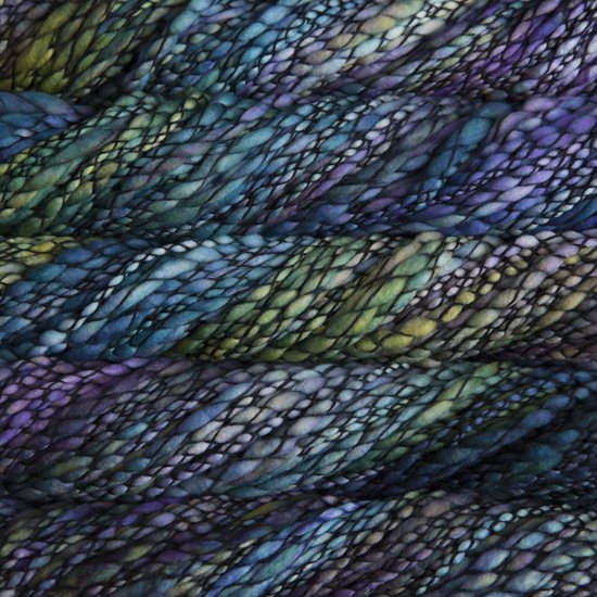 Skein of variegated blue, green and purple Malabrigo Caracol yarn.