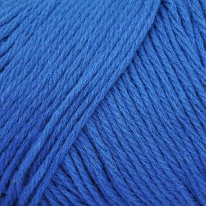 Close up on a lapis blue skein of Brown Sheep Cotton Fleece yarn.