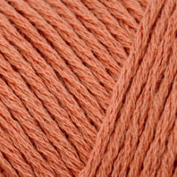 Close up on a terracotta skein of Brown Sheep Cotton Fleece yarn.