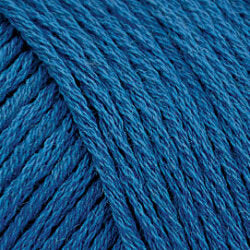 Close up on a turquoise blue skein of Brown Sheep Cotton Fleece yarn.