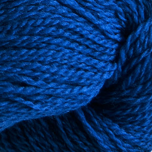 Close up on a cobalt blue skein of Cascade 220 Fingering yarn.