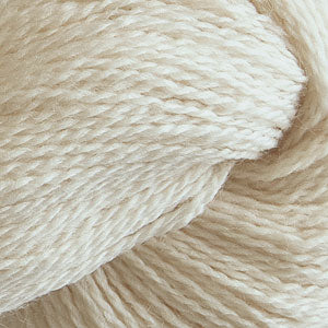 Close up on a natural white skein of Cascade 220 Fingering yarn.