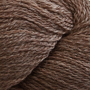 Close up on a heathered brown skein of Cascade 220 Fingering yarn.