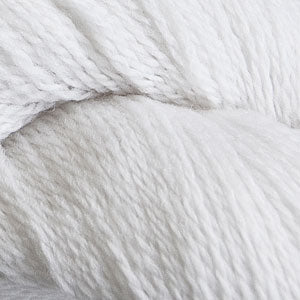 Close up on a white skein of Cascade 220 Fingering yarn.