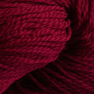 Close up on a dark red skein of Cascade 220 Fingering yarn.