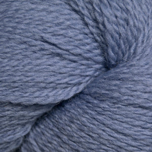 Close up on a light blue skein of Cascade 220 Fingering yarn.