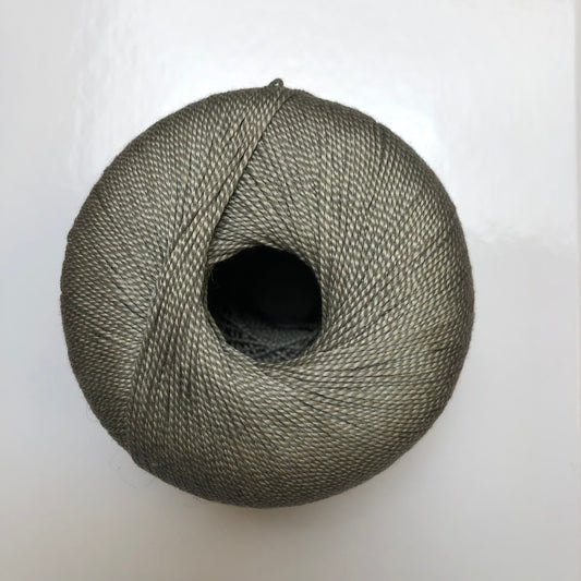 Ball of khaki green Isager Bomuld yarn.