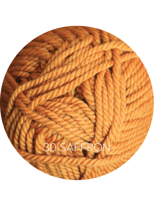 Close up on a golden orange ball of Ewe Ewe Baa Baa Bulky yarn.