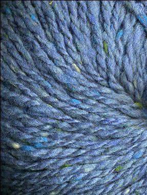 Close up on a blue tweed ball of Queensland Kathmandu Aran yarn.