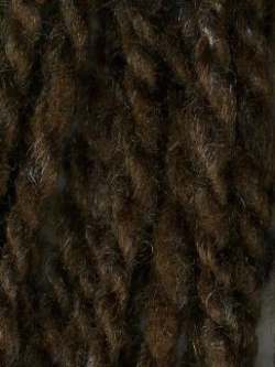 Close up on a dark brown tweed ball of Queensland Kathmandu Aran yarn.
