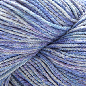 Close up on a speckled purple and blue skein of Cascade Nifty Cotton Splash yarn.