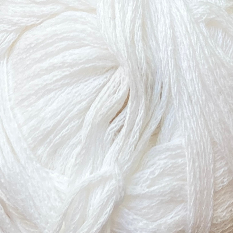 Close up on a white ball of M&K Eco Bomull yarn.