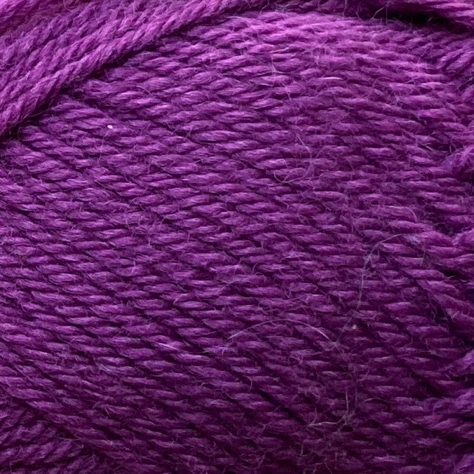 Close up on a fuchsia ball of Jo Sharp Classic Wool DK yarn.