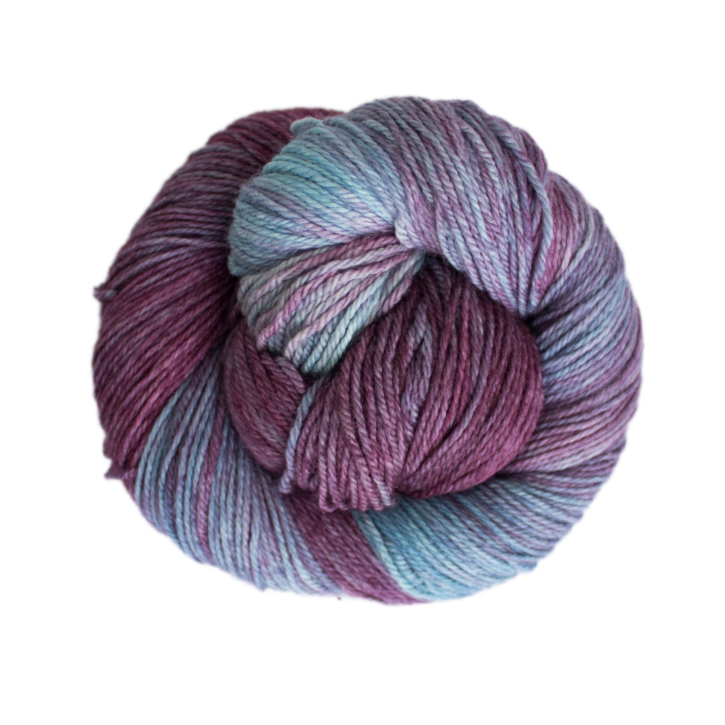 Skein of variegated blue and purple Malabrigo Finito yarn.
