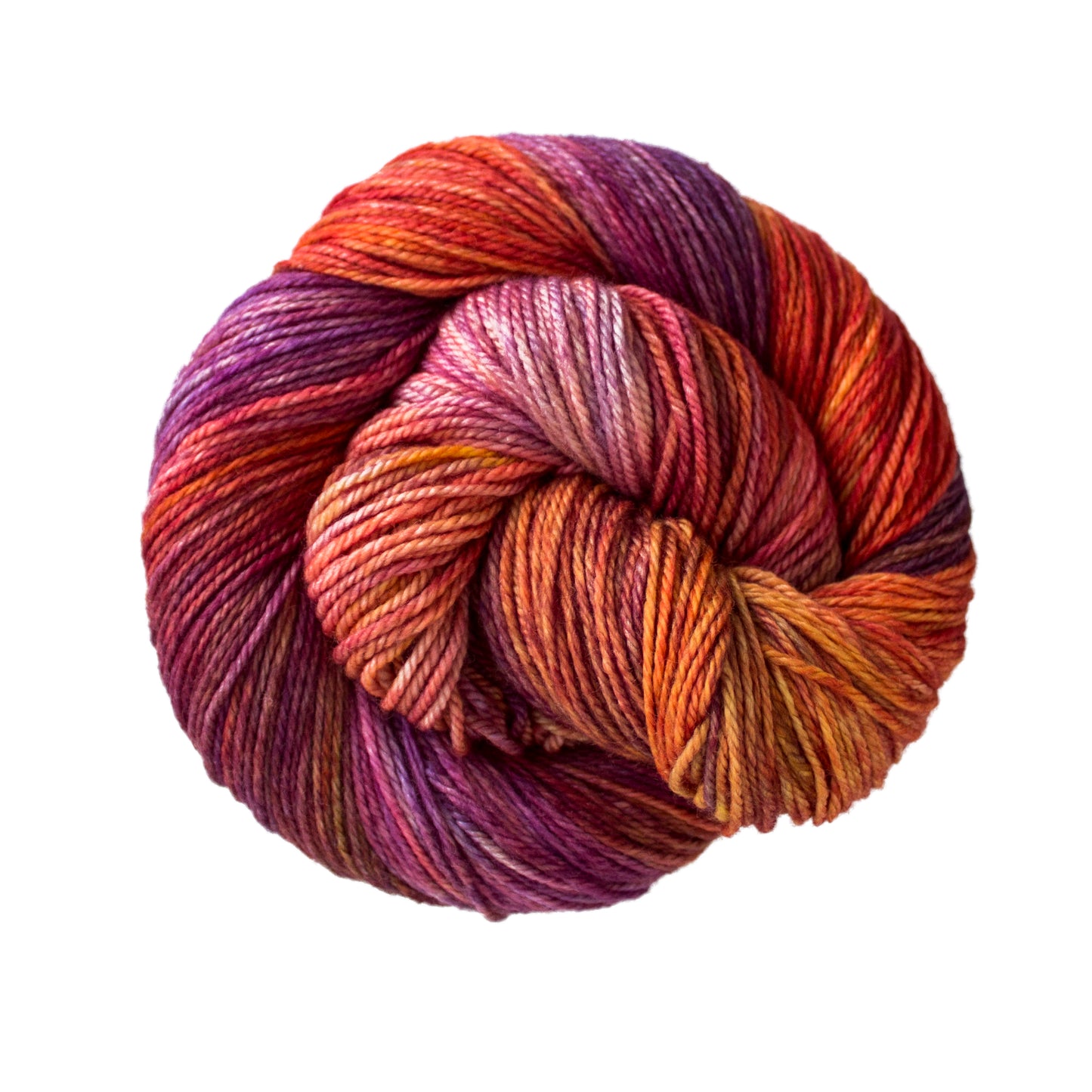 Skein of variegated red, orange and purple Malabrigo Finito yarn.