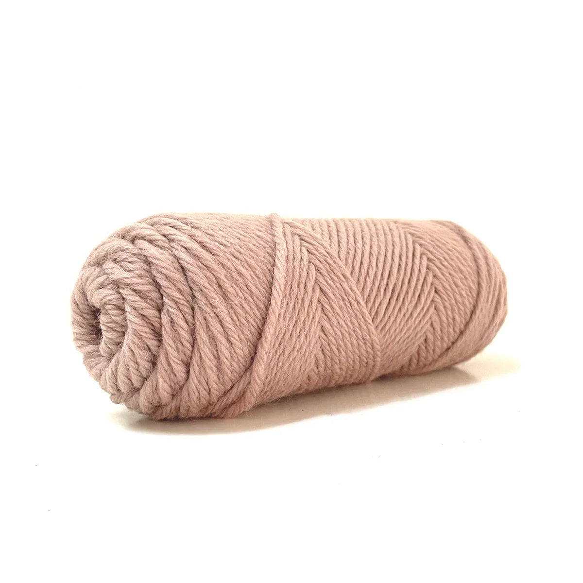 A skein of tan Kelbourne Woolens Germantown Bulky yarn.