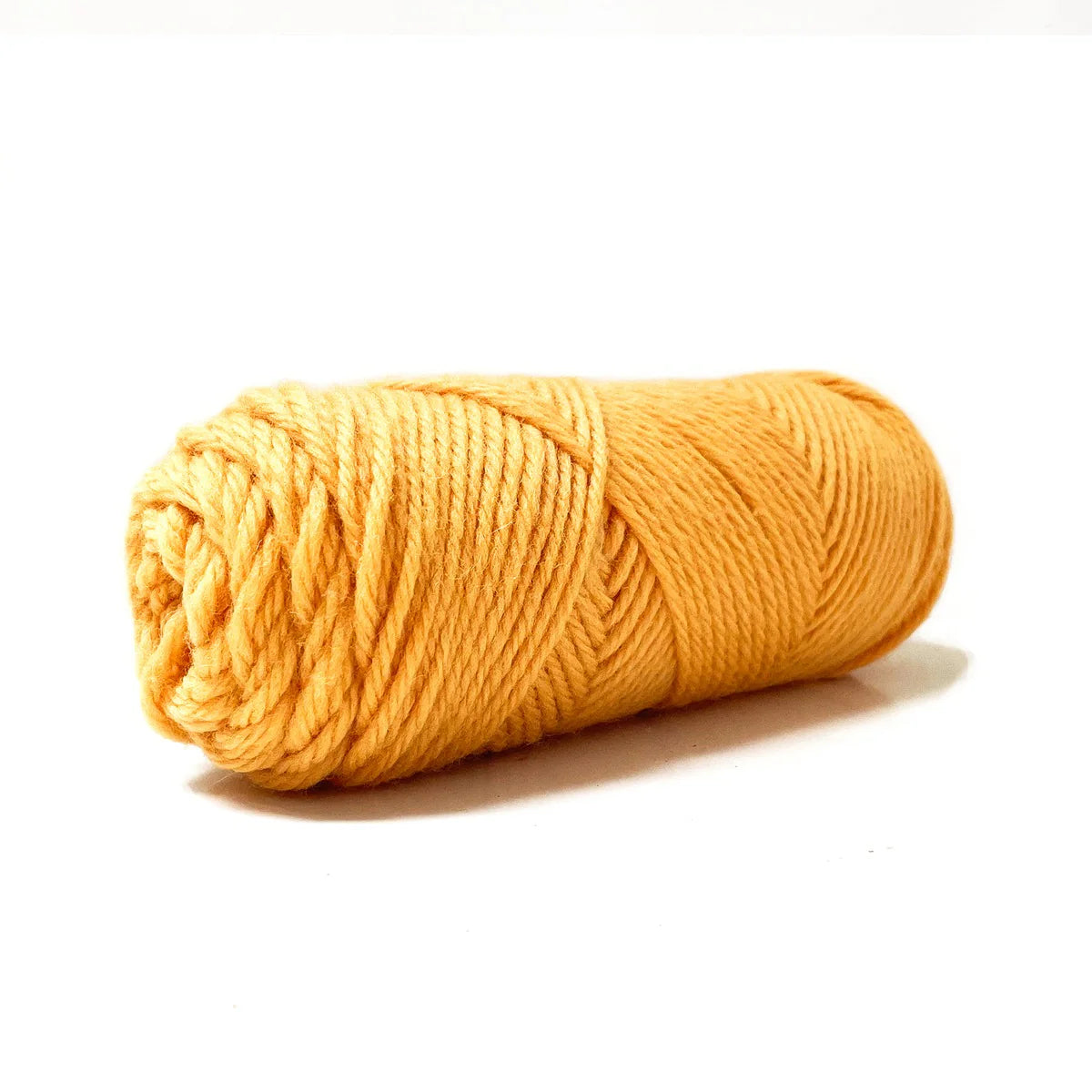 A skein of yellow Kelbourne Woolens Germantown Bulky yarn.