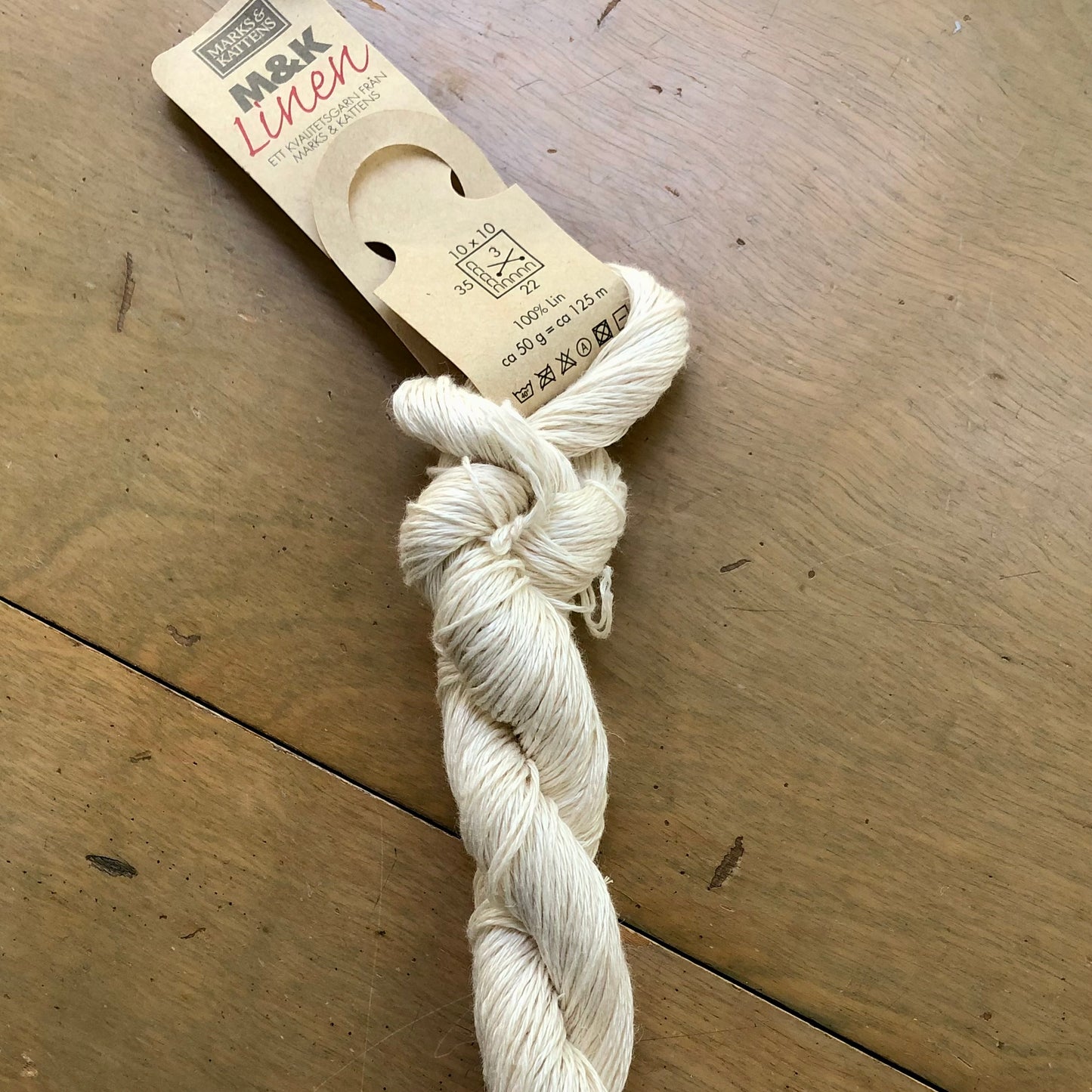 Ivory skein of M&K Linen yarn.